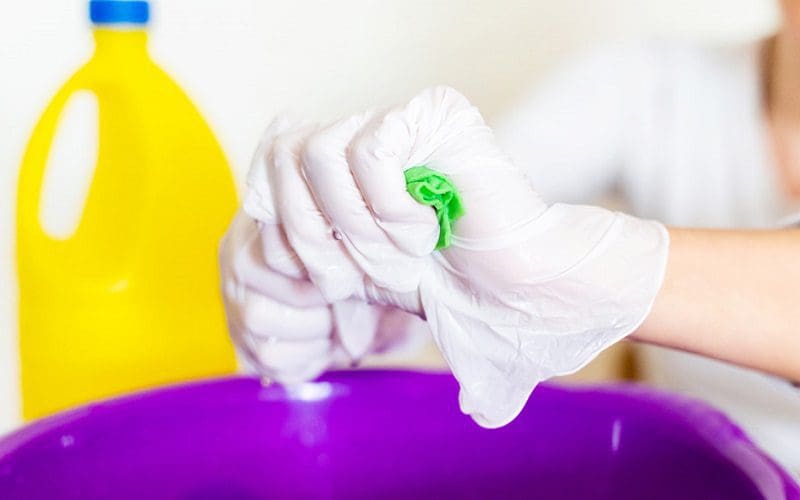 lady cleaning with bleach